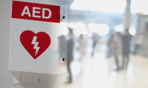 Aed,Automated,External,Defibrillator,Sign,At,An,Airport.,Double,Exposure